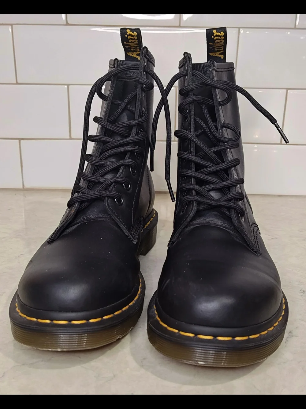 Dr. Martens Black Leather 8-Eye Lace-Up Boots with Yellow Welt Stitching